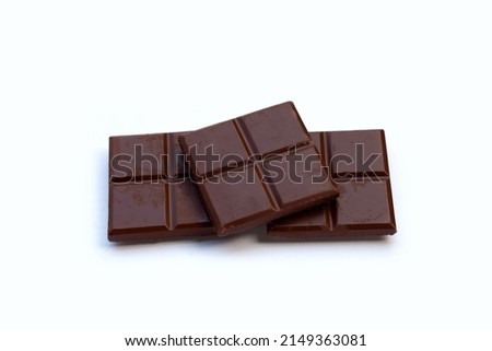 Square biscuits in dark chocolate