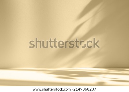 Abstract beige studio background for product presentation. Empty room with shadows of window and flowers and palm leaves . 3d room with copy space. Summer concert. Blurred backdrop. Royalty-Free Stock Photo #2149368207