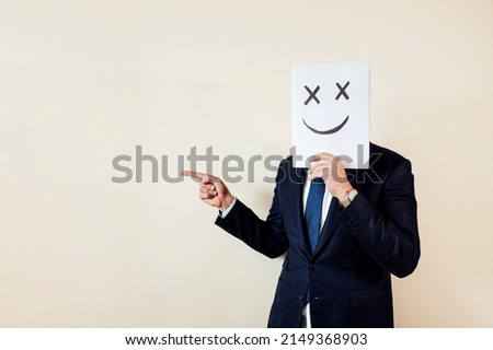 Businessman take billboard pointing to the side.