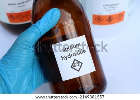 Sodium hydroxide in bottle, chemical in the laboratory and industry Royalty-Free Stock Photo #2149381557