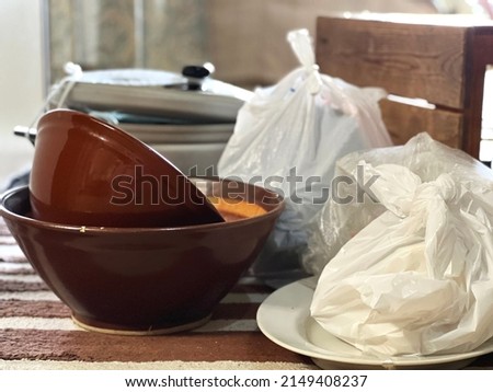 Garbage such as pots, plates, and mortars in indoors