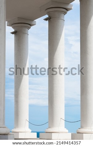 Fundamental white columns of architecture against the blue sky. Royalty-Free Stock Photo #2149414357