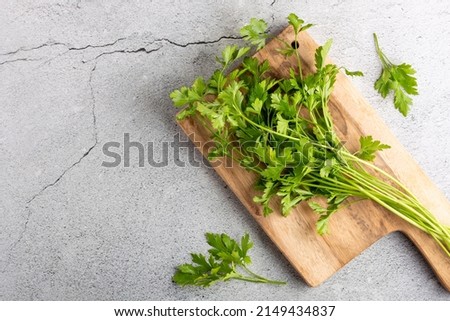 Fresh italian parsley on the table. Green parsley. Royalty-Free Stock Photo #2149434837