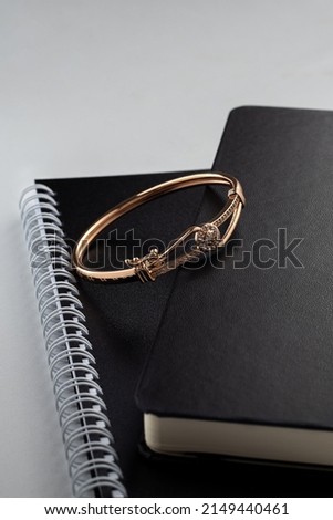 Gold bracelet on the office desk