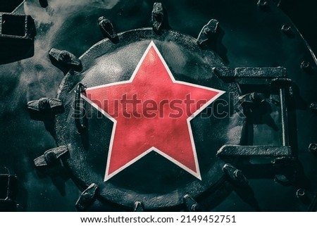 Big red star in front of an old historic locomotive. Vintage background