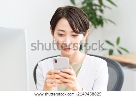 Asian woman working in office