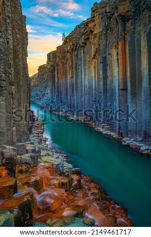 Studlagil Canyon with the Jokulsa A Bru river in east Iceland photographed at sunset. Royalty-Free Stock Photo #2149461717