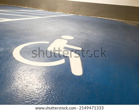 International Symbol of Access for Disabled People in an Underground Parking Lot 