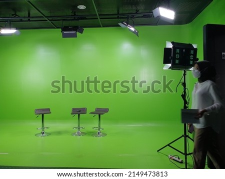 High chair in photo studio with green background