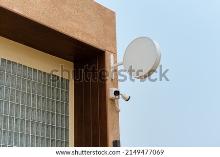Empty shop sign and CCTV camera hanging on corner building of cafe store