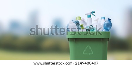 Recycling bin full of plastic waste, separate waste collection concept Royalty-Free Stock Photo #2149480407