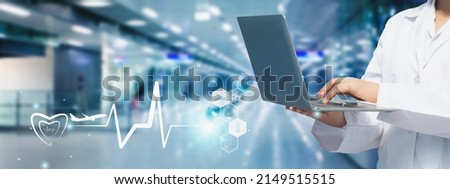 Doctor using laptop computer with hospital background, business treatment service vacation wellness global trip, medical icon travel and tourism health care insurance Concept.