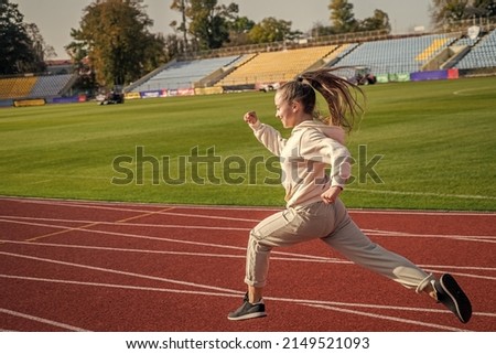 The rule in running is just run. Energetic girl run on running track. Sports school Royalty-Free Stock Photo #2149521093