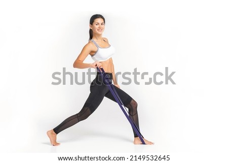 young beautiful yoga posing on a white studio background
