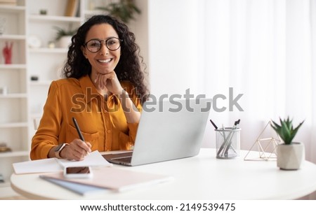 Happy Brunette Business Lady Using Laptop Smiling To Camera Posing Wearing Glasses Working Sitting At Workplace In Modern Office. Successful Entrepreneurship And Career Concept Royalty-Free Stock Photo #2149539475