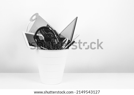 Planned obsolescence, e-waste, electronics waste for reuse and recycle concept. Recycling bin full of old electronic devices Royalty-Free Stock Photo #2149543127