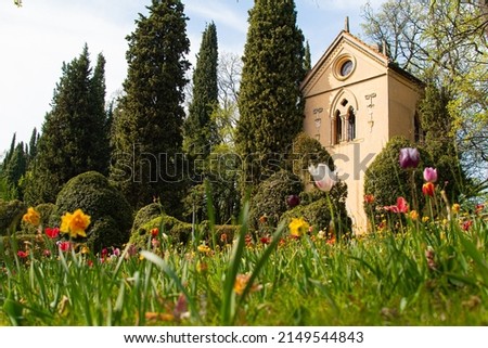 fairy tail garden with flowers and castle in sigurta italy
