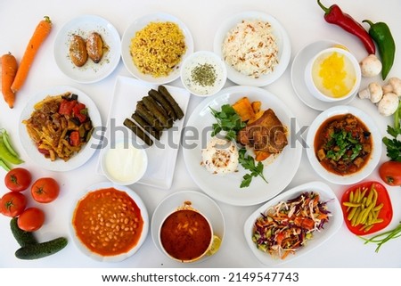 Table scene of assorted take out or delivery foods. Traditional Turkish cuisine. Various Turkish meal and appetizers. Top down view on a table. Royalty-Free Stock Photo #2149547743