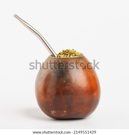 Calabash gourd with bombilla. tableware for the traditional Latin American tonic drink Yerba mate Royalty-Free Stock Photo #2149551429