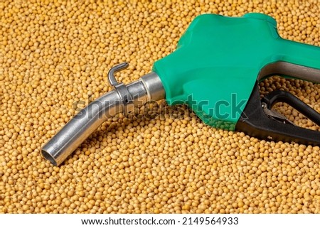 Diesel fuel nozzle and soybeans. Biodiesel, biofuel, agriculture and renewable clean energy concept.  Royalty-Free Stock Photo #2149564933