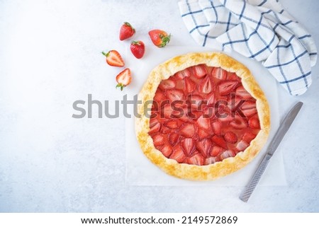 Strawberry galette on a paper sheet. toning. selective focus