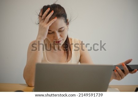 Woman feeling pain after working on computer laptop for a long time, Office syndrome concept