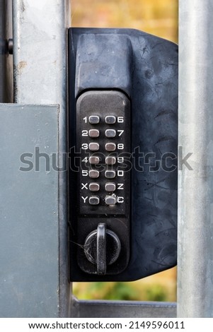 Numerical keypad lock securing an external gate Royalty-Free Stock Photo #2149596011