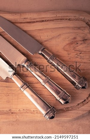 Product photography, knives on board.