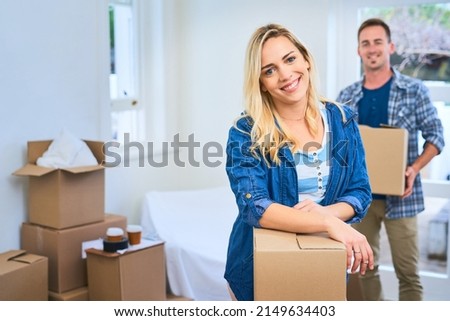 Glad to have a new place to call home. Portrait of a young couple moving house.