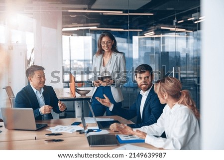 A group of business people partners during a set team meeting in the modern office.High quality  Royalty-Free Stock Photo #2149639987