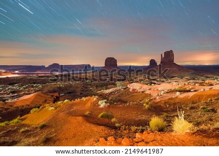 Monument Valley under the stars, night view of famous buttes and valley traffic, very long exposure.