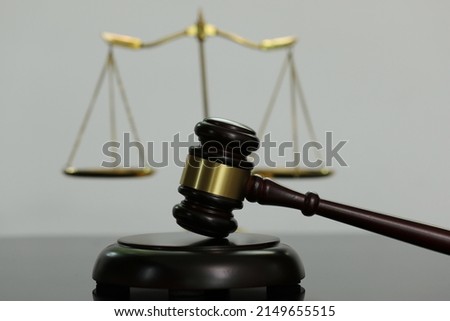 Close-up judge's hammer, scales, business legal advisor. Judge Counsel Legal service concept with judge's hammer and golden scales.