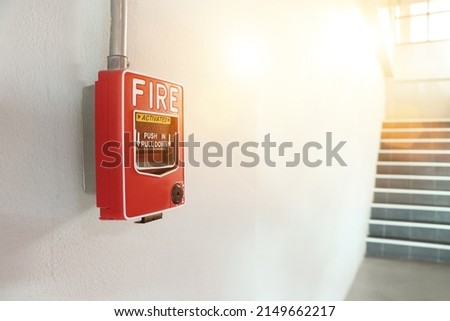 
Fire alarm switch on factory wall.