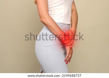 Menstrual pain, woman with stomachache suffering from pms , endometriosis, cystitis and other diseases of the urinary system, painful area highlighted in red