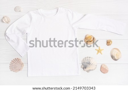 T Shirt long sleeve mockup flat lay Sea shells white wooden background. Summer vacation concept
