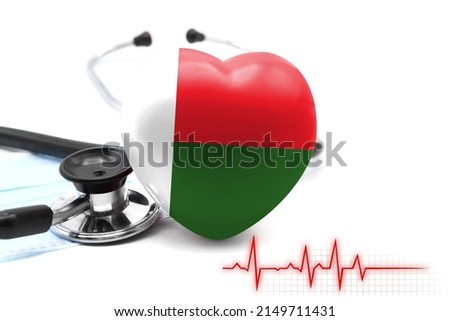 Flag of Madagascar in the form of a heart next to a stethoscope, the concept of the world health system
