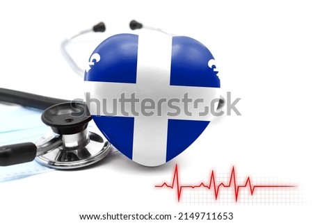 Flag of Quebec in the form of a heart next to a stethoscope, the concept of the world health system