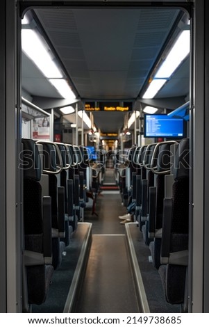 Train inside, empty seats on the train.