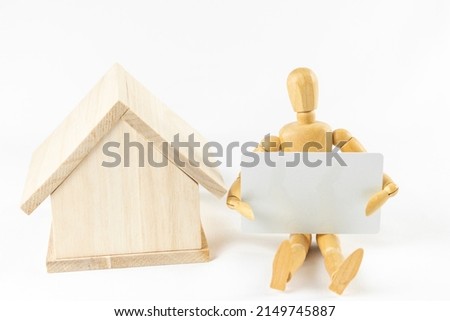 Image of a drawing doll buying a house