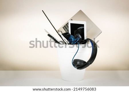 Planned obsolescence, e-waste, electronics waste for reuse and recycle concept. Recycling bin full of old electronic devices Royalty-Free Stock Photo #2149756083