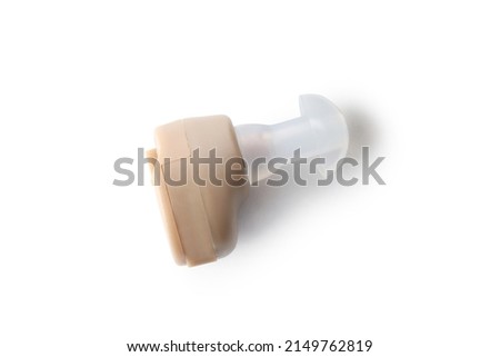Hearing aid isolated on white background, close up