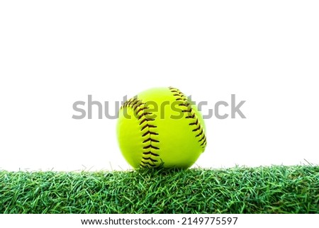 green softball on grass with white background