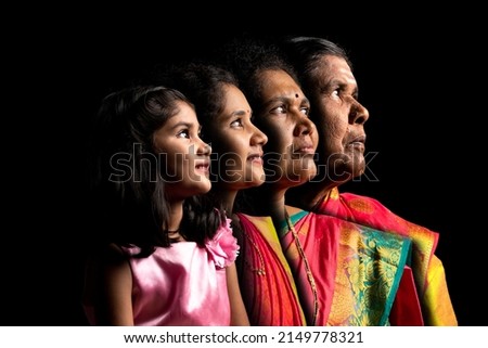 four generation Indian family in traditional dress - concept of aging process, family and togetherness Royalty-Free Stock Photo #2149778321