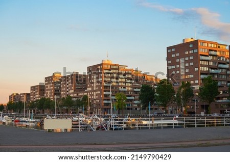 Beautiful cityscape with modern buildings near river Royalty-Free Stock Photo #2149790429