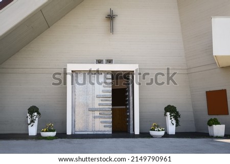 Entrance of modern church on spring day