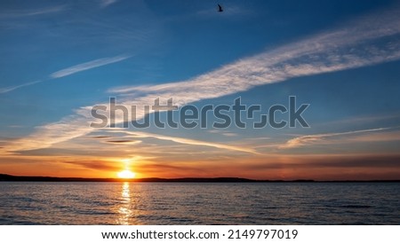 A peaceful sunset on the seashore. Rich, warm evening colors
