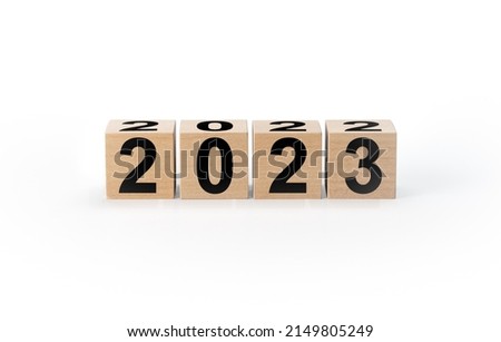 Wooden Blocks With 2022 2023 Number isolated on white background. Start new year 2023 with goal plan, goal concept, action plan, strategy, new year business vision. Concept of new year 2023 resolution