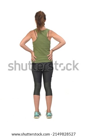 woman with sportswear hand on hip on white background