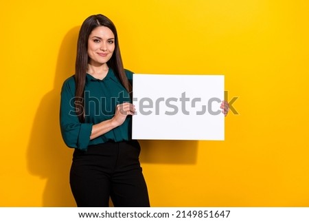 Photo of sweet shiny woman wear green shirt rising white empty space isolated yellow color background