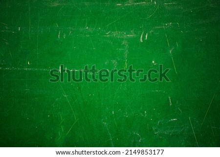 Green school board with scratches and scuffs. Royalty-Free Stock Photo #2149853177